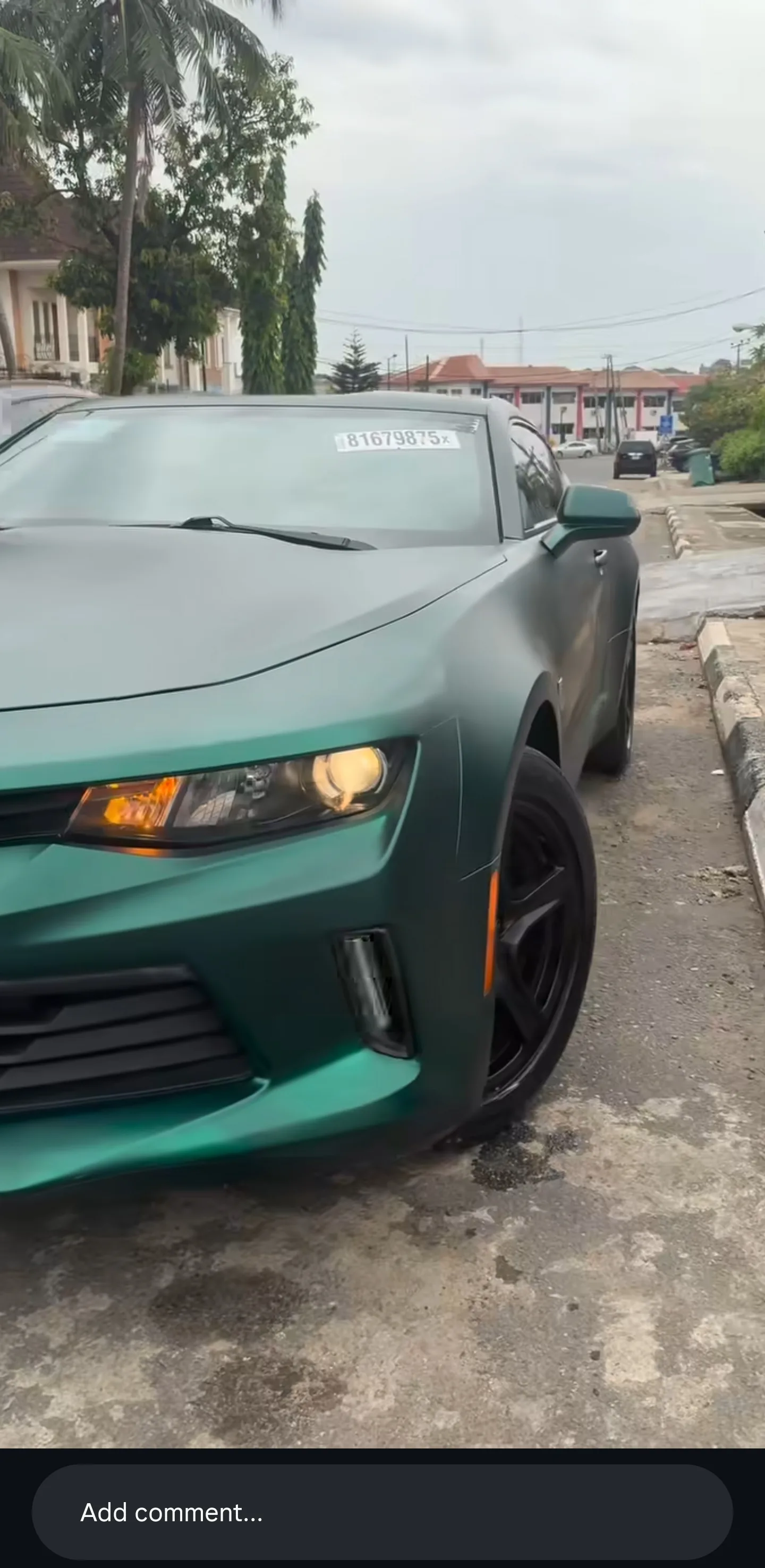 Chevrolet Camaro matte dark green wrap front quarter complete Lagos street