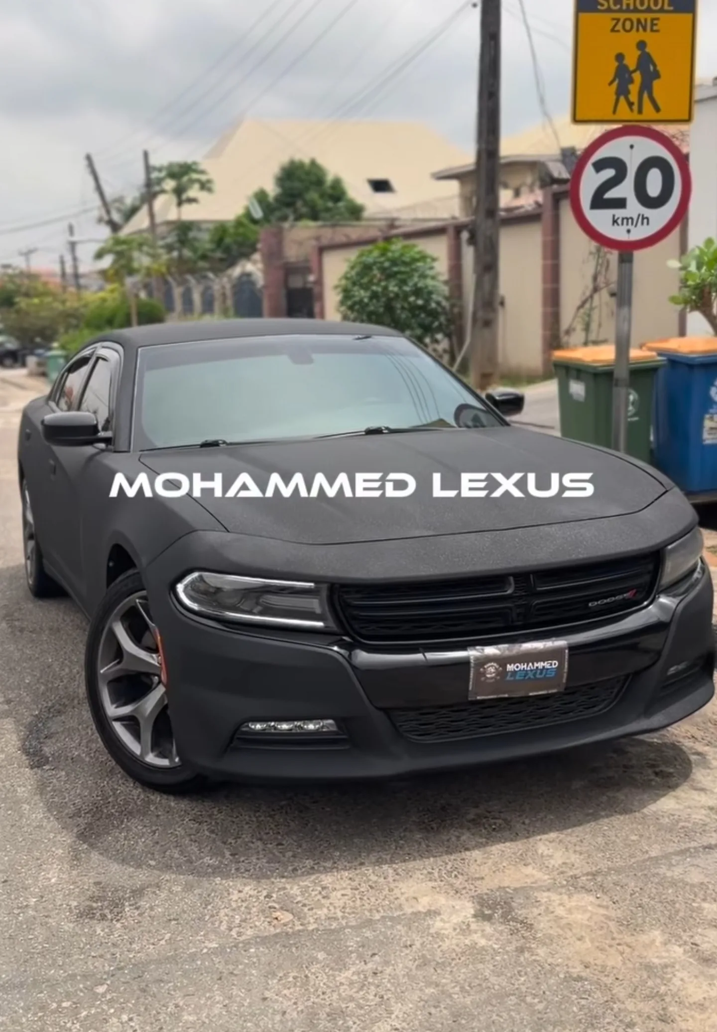 Dodge Charger Black Diamond matte black rewrap complete front quarter view Lagos