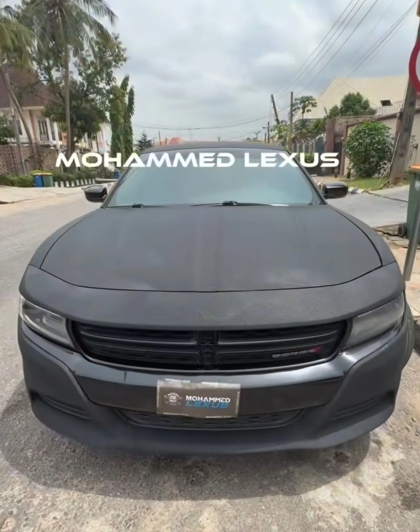 Dodge Charger after Black Diamond matte black rewrap, front view, completed at Mohammed Lexus Lagos