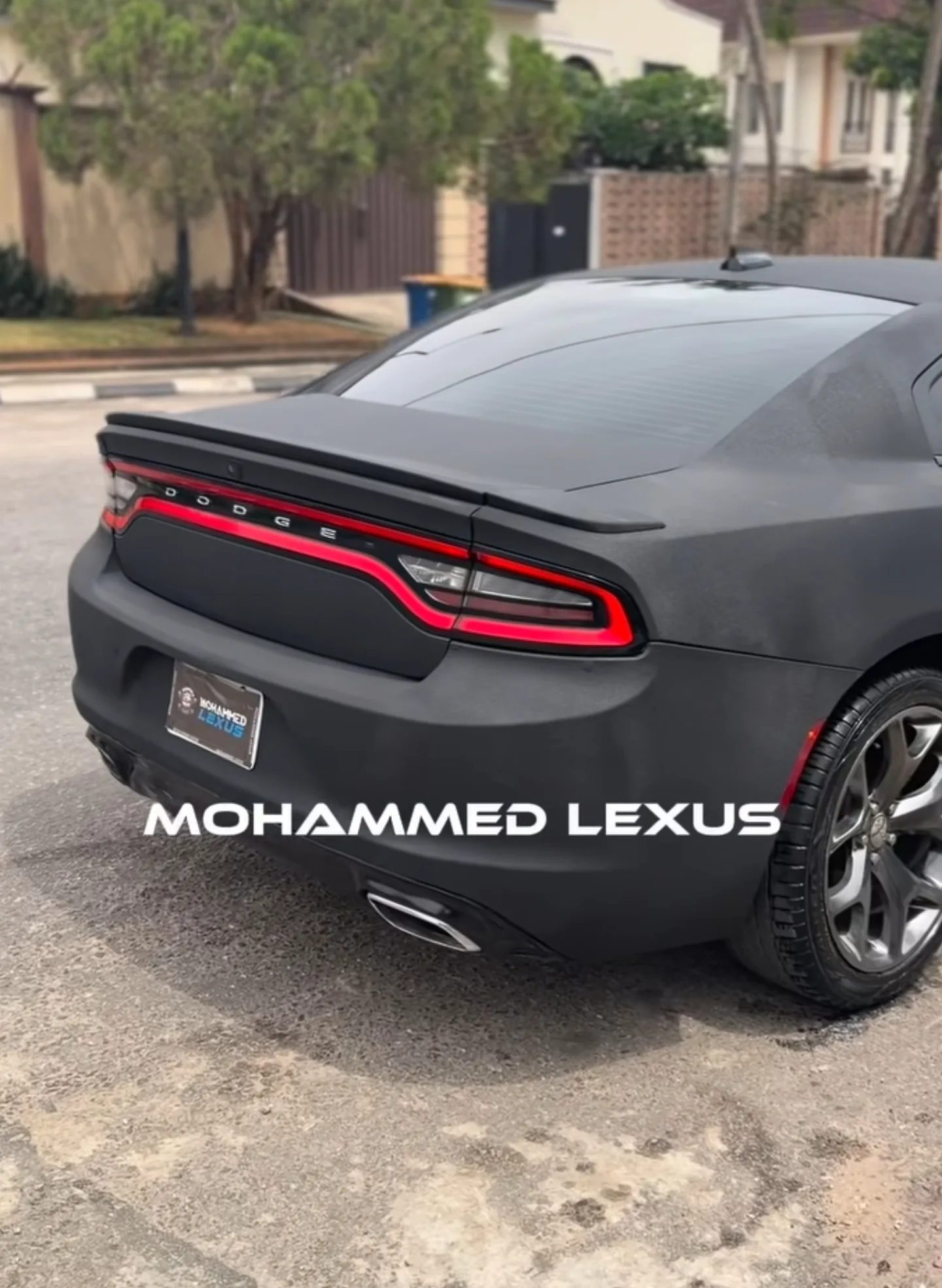Dodge Charger Black Diamond matte black rewrap, rear view, completed at Mohammed Lexus Lagos