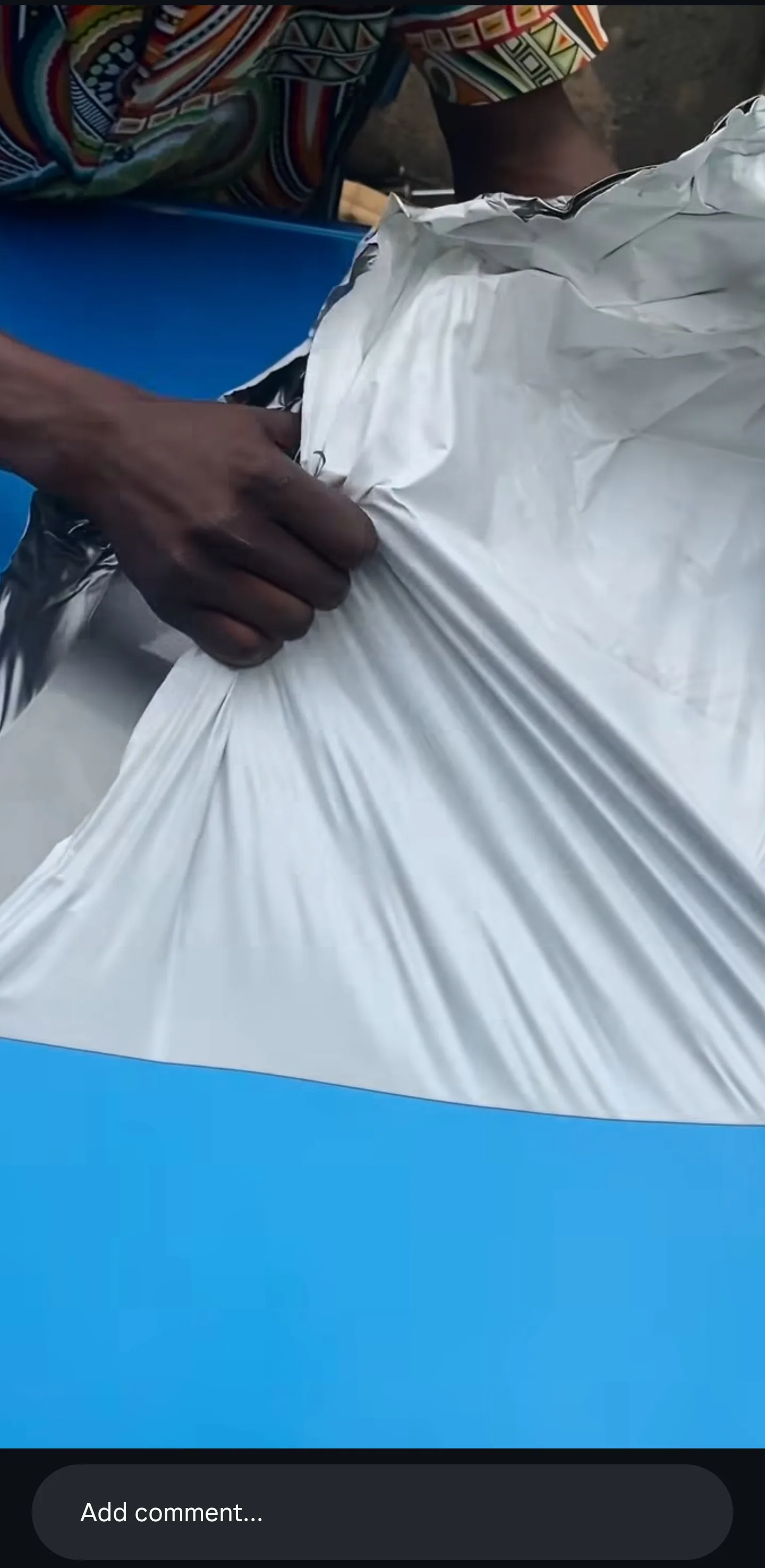 Close-up of the Dodge Charger wrap peeling away cleanly, showing undamaged paint surface beneath