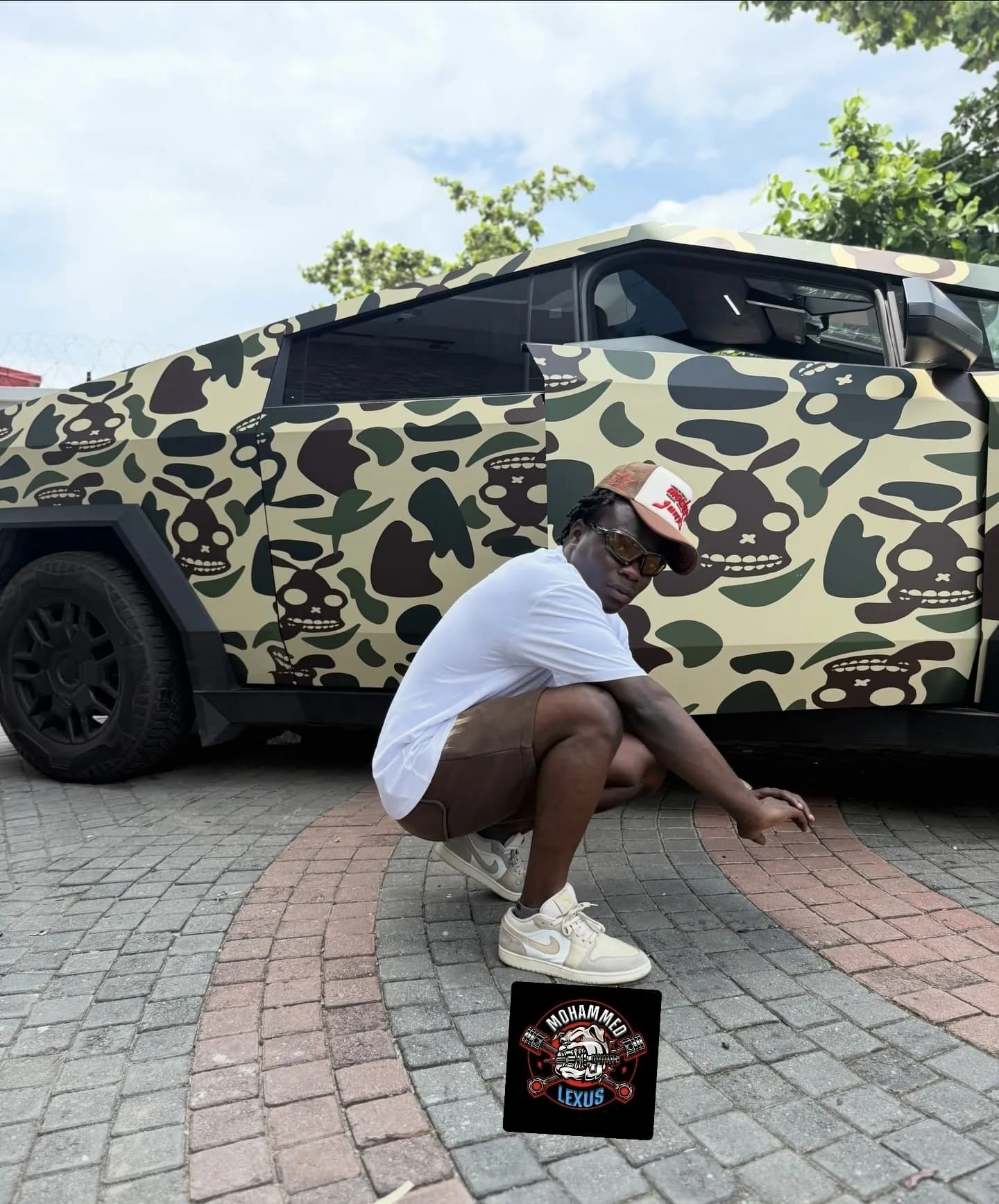 WBY GoCrazy client portrait with Tesla Cybertruck BAPE camo wrap Mohammed Lexus Lagos