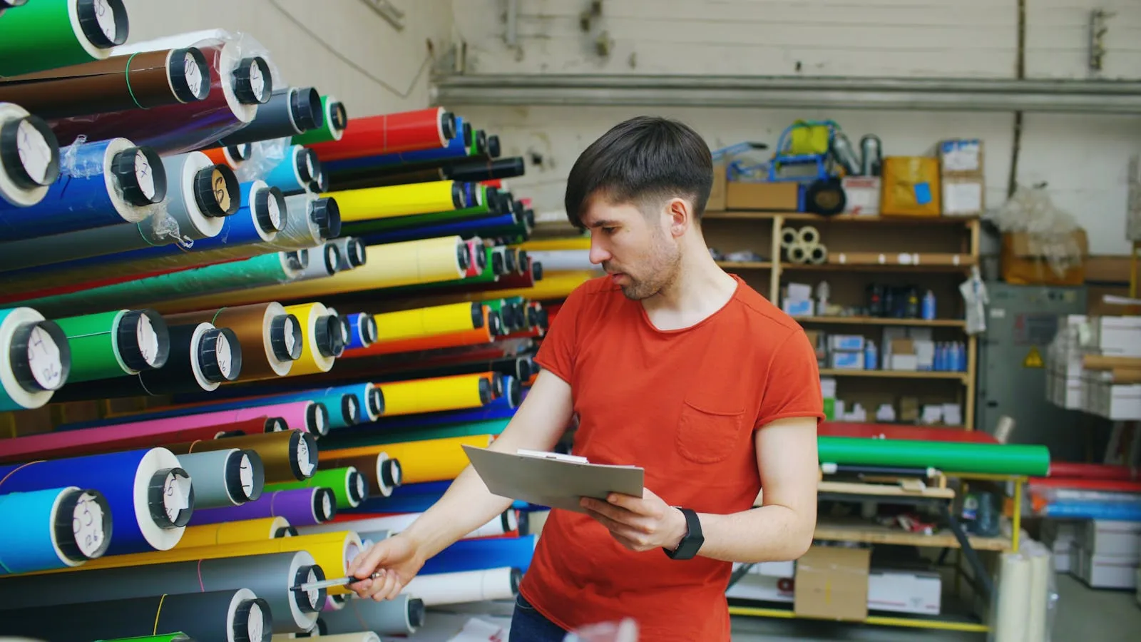 Colourful vinyl wrap rolls in workshop ready for application Nigeria