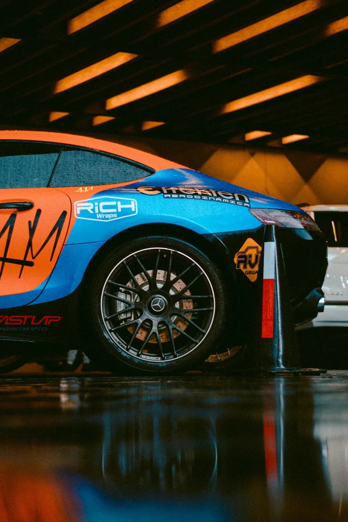 Wrapped sports car with dramatic colour change indoor showroom reflection result