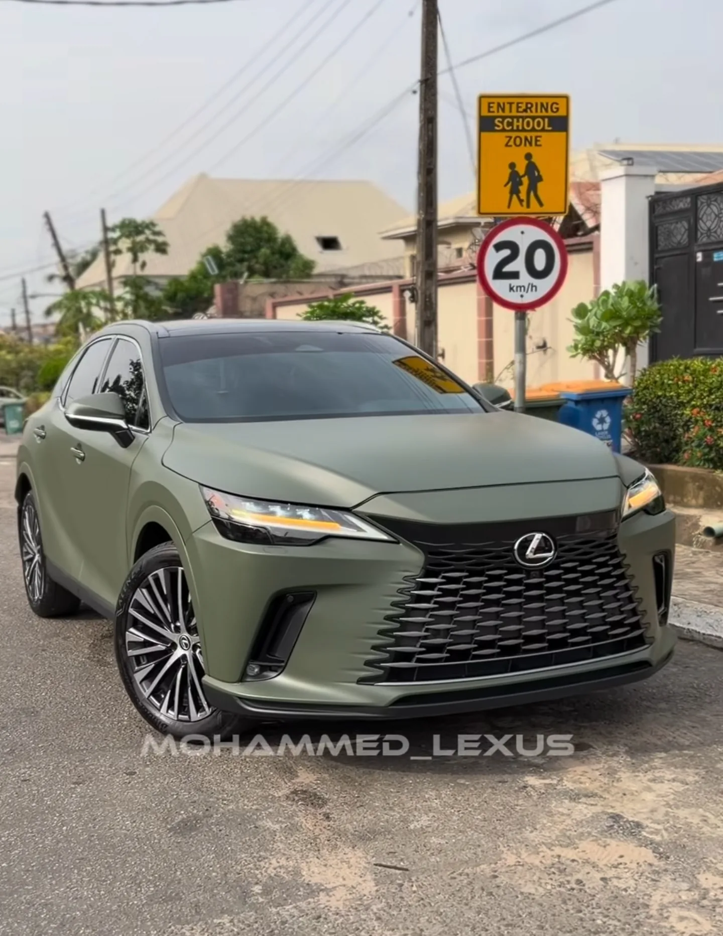 2026 Lexus RX350 in matte military green vinyl wrap front quarter view completed Lagos