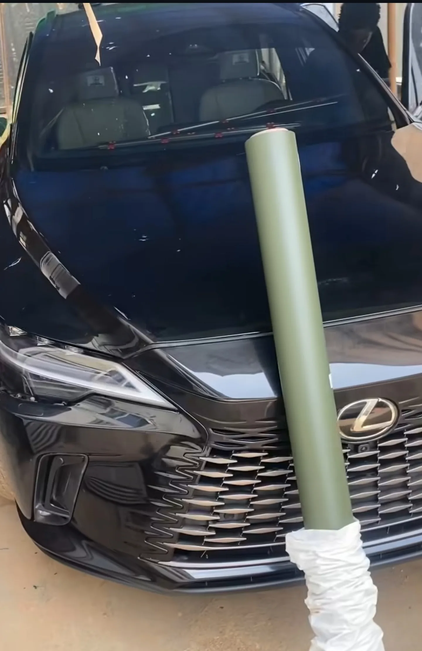 Matte military green vinyl roll colour reveal during wrap prep Mohammed Lexus