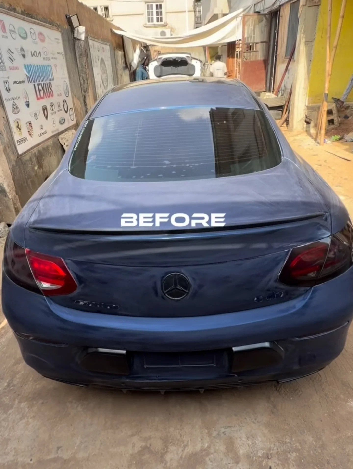 Mercedes C43 AMG dark navy blue rear view before wrap Mohammed Lexus Lagos workshop