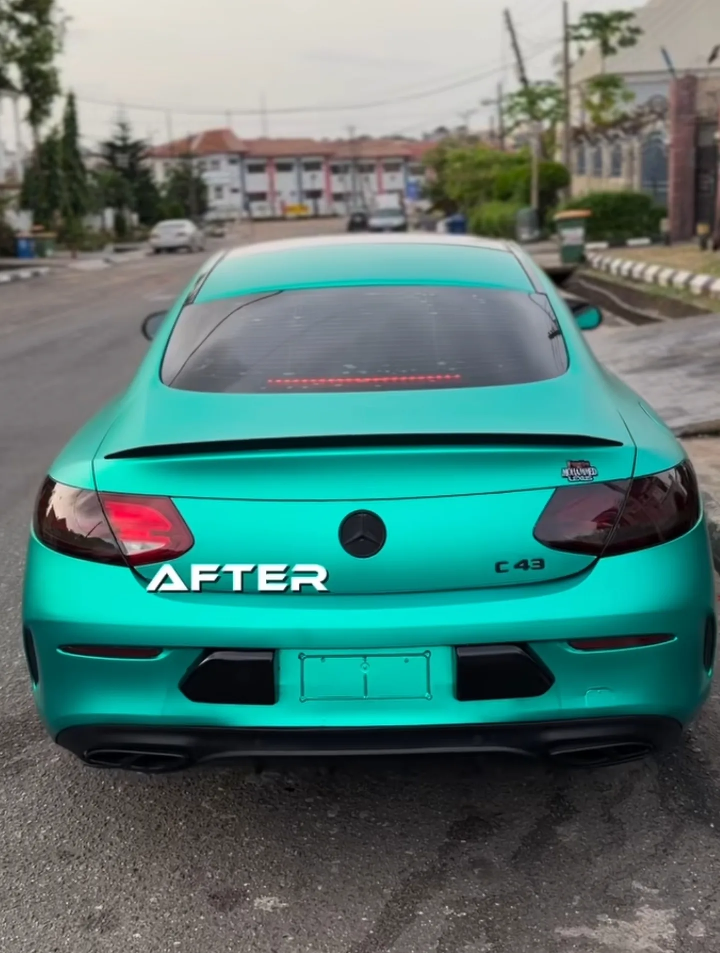 Mercedes C43 AMG satin aqua green wrap after rear view Lagos