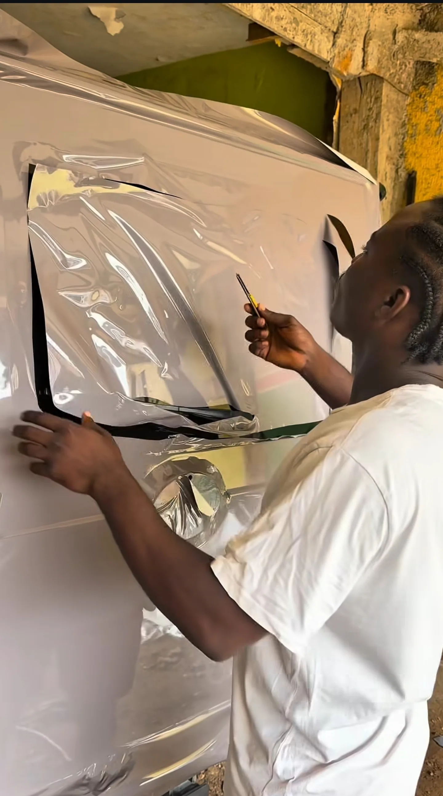 Mercedes G-Wagon vinyl wrap installation process applying vinyl Lagos workshop