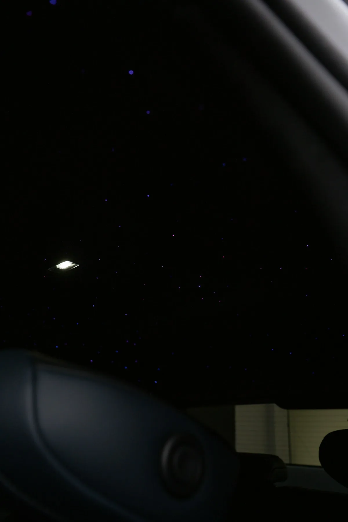 Dark car interior ceiling with fiber optic star dots blue white starlight headliner aftermarket install
